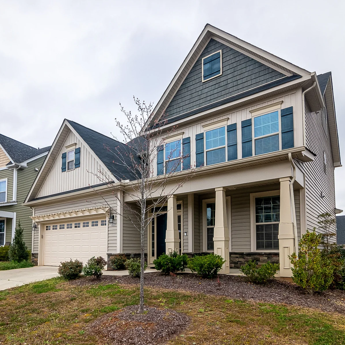 Home exterior with blue-gray siding and a covered front porch
